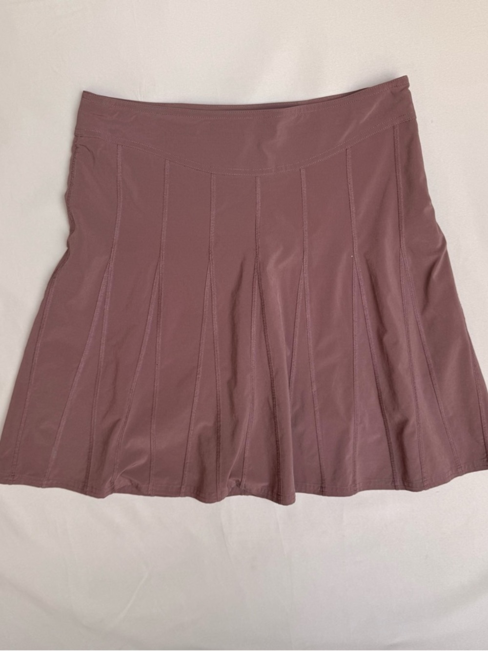 Athleta brand pleated athletic skort in a mauve or purple shade